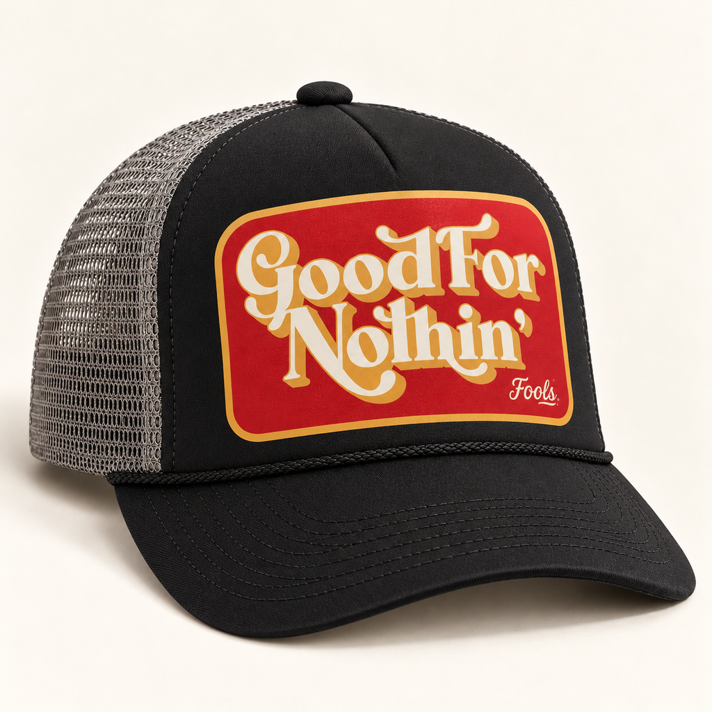 FOOLS Good For Nothin trucker hat with black foam front and bill, gray mesh back and retro red and cream print.