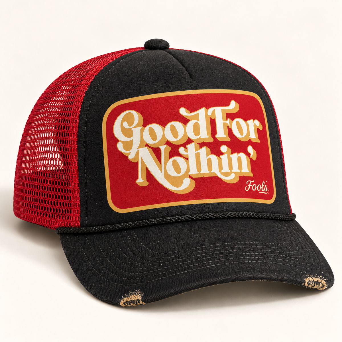 FOOLS Good For Nothin black foam and red mesh trucker hat with vintage worn bill edges and retro cream and red print.