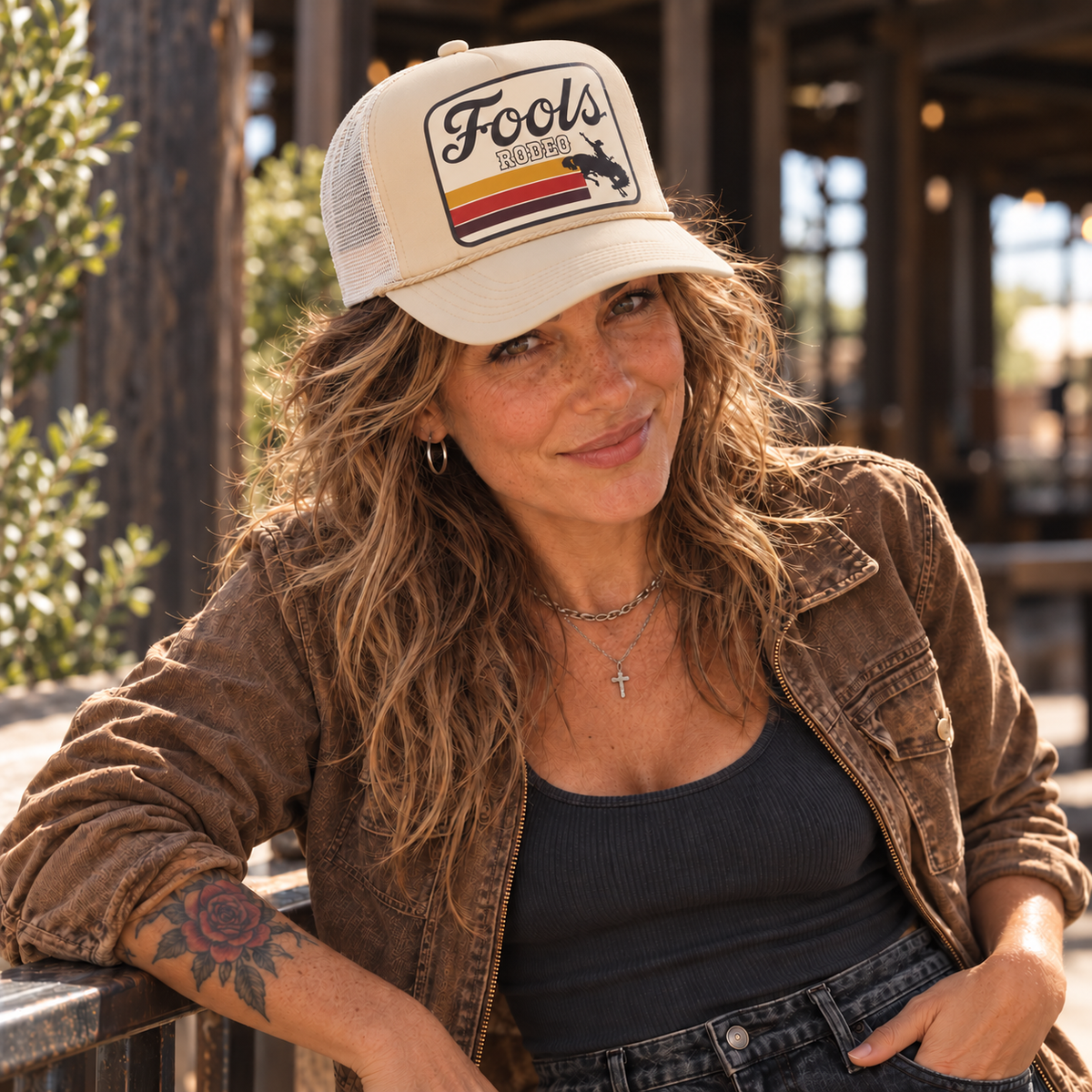 FOOLS Rodeo beige foam-front and white mesh trucker hat styled with a worn tobacco work jacket and charcoal tank.
